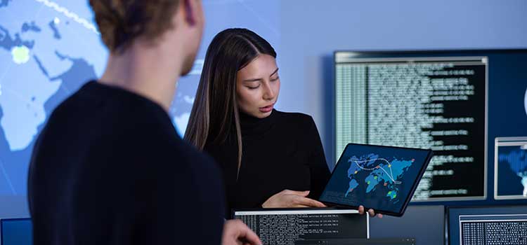 cyber security analyst shows coworker map of vulnerable geo locations