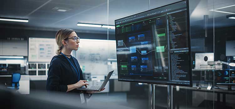 cuber security analyst checks data security on large tv screen